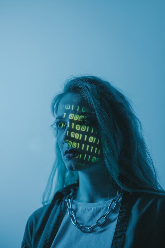 creative Stylized portrait of a woman with binary code projected on her face, evoking themes of technology and identity.